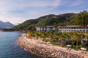 a resort on the shore of a body of water at Boma Resort Nha Trang in Nha Trang