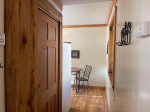 a hallway with a door and a table in a room at Red River Condo #4 in Red River