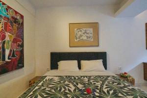 Rumah Paros & Gallery客房内的一张或多张床位