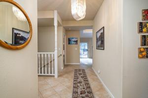 a hallway of a home with a mirror at Happy Trails - Updated 3-Bedroom Home with Cozy Sunroom and Spacious Deck home in Groveland