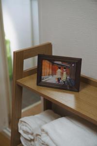 En eller flere senge i et værelse på Meet Higashikujo