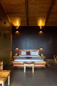 a bedroom with a large bed in a room at Umutuzo lodge Kivu lake 