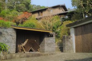 a building with a wooden door on the side of it at 古淡 - Kotan in Awaji