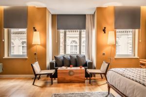 a bedroom with a couch and two chairs and a bed at Ansen Hotel and Suites in Istanbul +191 photos