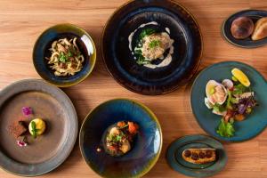 a group of plates of food on a table at 古淡 - Kotan in Awaji