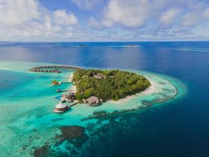 an island in the ocean with a group of resorts at Baros Maldives in Male City