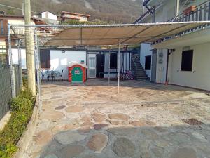 a patio with a playground in a house at Cà Negra Ca negra suite in Costa Volpino