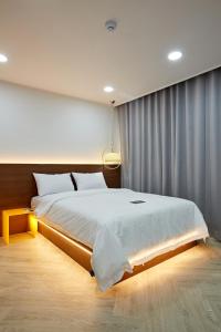 Postel nebo postele na pokoji v ubytování Hotel sounds