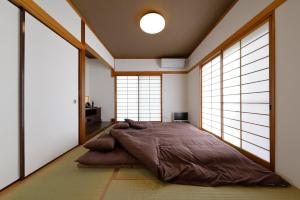 Ένα ή περισσότερα κρεβάτια σε δωμάτιο στο Otsuki Resonal Saruhashi