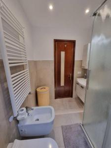 a bathroom with a toilet and a sink and a shower at Casa D&D in Alassio