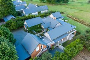 an aerial view of a house with blue roofs at Dornoch on Gowrie Farm, Nottingham Road in Nottingham Road