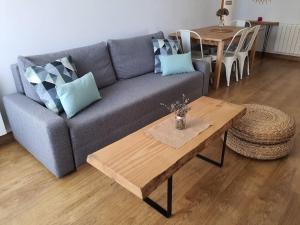 a living room with a couch and a table at El Rincón de Gabriela in Suances
