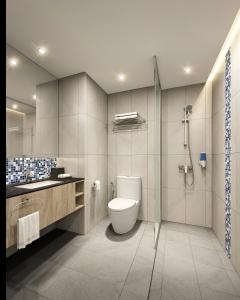 a bathroom with a toilet and a glass shower at Holiday Inn Express & Suites Singapore Novena, an IHG Hotel in Singapore