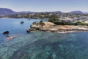 an aerial view of a small island in the water at Aldemar Knossos Villas in Hersonissos