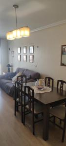 a living room with a table and a bed at apart paz in Torrevieja