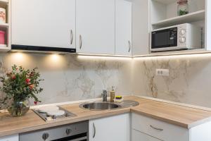 Kuchyň nebo kuchyňský kout v ubytování Apartment M&K
