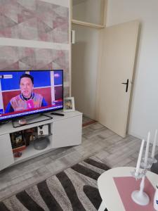 a living room with a flat screen tv at Zgrada, stan in Kruševac