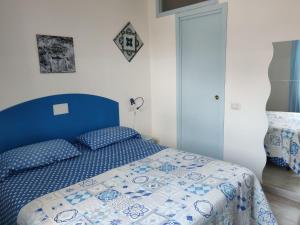 A bed or beds in a room at La Rosa di Orvieto