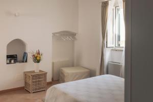 Postel nebo postele na pokoji v ubytování Il Vicinato, casa vacanza immersa nel cuore dei Sassi