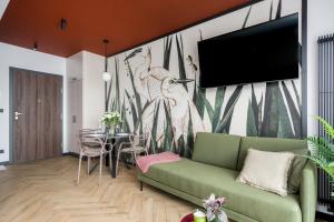 Televízia a/alebo spoločenská miestnosť v ubytovaní Apartments City View Garbary by Noclegi Renters