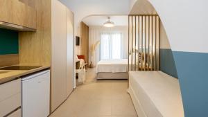 Kuchyň nebo kuchyňský kout v ubytování Aether Green Apartments