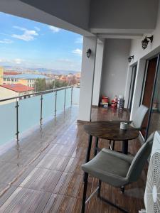 a balcony with a table and chairs and a view at Sarah Relax 1 in Drobeta-Turnu Severin
