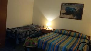 Ένα ή περισσότερα κρεβάτια σε δωμάτιο στο mini Residence Samarcanda appartamenti