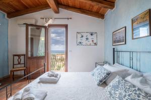 Ένα ή περισσότερα κρεβάτια σε δωμάτιο στο CASABELLAVISTA