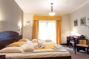 Posteľ alebo postele v izbe v ubytovaní Hotel Studanka