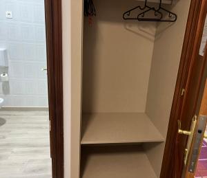 a walk in closet with a glass door at Pension Norte in Portugalete +107 photos