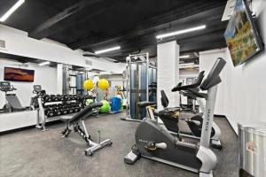 a gym with treadmills and exercise equipment in it at UWS 2br w elevator doorman gym nr Central Park NYC-952 in New York