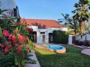 a house with a swimming pool in the yard at BARIDI VILLA in Kiwengwa