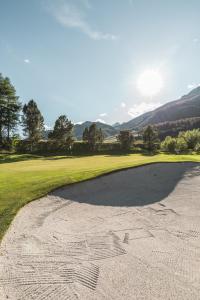 a view of the ninth green on the golf course at Cresta Palace Celerina in Celerina