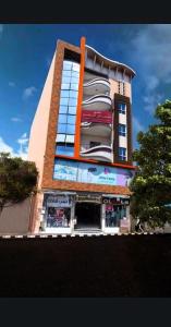 a tall building with a store in front of it at cozy apartment Aircon Downtown Aswan in Aswan