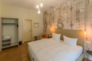 Un pat sau paturi într-o cameră la Albergo-Toscana