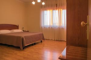 Postel nebo postele na pokoji v ubytování Ruggiero Park Hotel