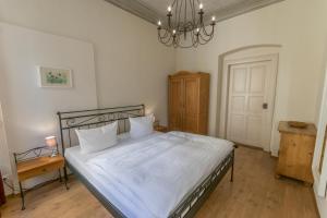 Un pat sau paturi într-o cameră la Albergo-Toscana