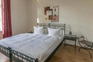 Un pat sau paturi într-o cameră la Albergo-Toscana