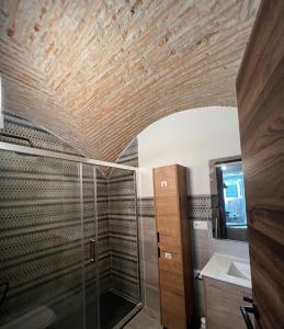 a bathroom with a shower and a glass shower stall at Consolación17 in Cáceres +21 photos