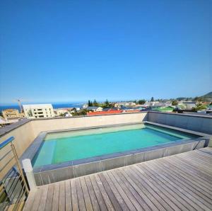 a large swimming pool on top of a building at *Self-Check in - Whale Watching Paradise -Central* in Hermanus