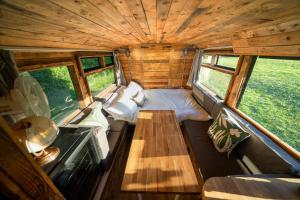 an inside view of a tiny house with a table at Delightful 2 Bed Double Decker Bus with Hot Tub in Uckfield