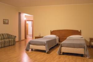 Postel nebo postele na pokoji v ubytování Ruggiero Park Hotel