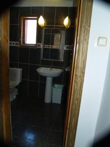 a bathroom with a sink and a mirror at Predeal Club in Predeal +36 photos