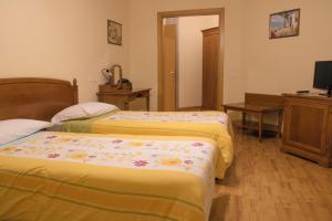 Postel nebo postele na pokoji v ubytování Ruggiero Park Hotel