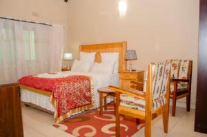 Postel nebo postele na pokoji v ubytování ROYAL SHALOM HOTEL