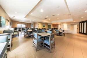 a dining room with tables and chairs at Best Western Inn & Suites San Diego Zoo -SeaWorld Area in San Diego