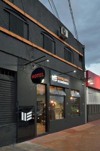 a hotel sign on the side of a building at HOTEL Vitoria in Ribeirão Preto