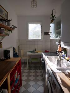 a kitchen with a sink and a table in it at Private room in the centre of Berlin in Berlin