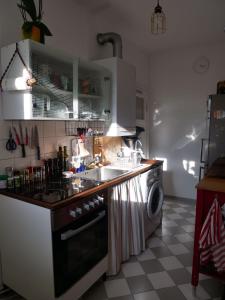 a kitchen with a sink and a washing machine at Private room in the centre of Berlin in Berlin