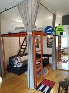 a room with a bunk bed and a couch at Downtown Dream in Zagreb